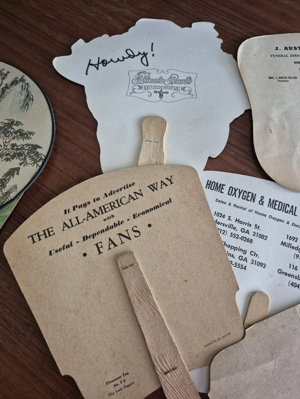 Assorted vintage advertising fans